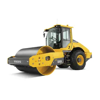 Soil compactor compressing ground surface on construction project