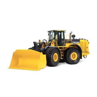 Loader transporting construction materials on jobsite