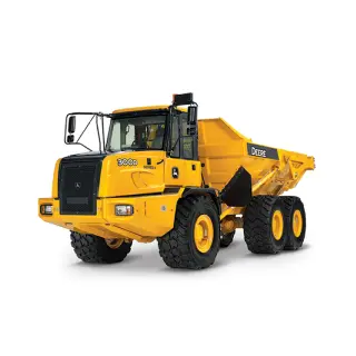 Off-road dump truck hauling materials on rough terrain