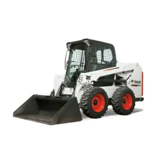 Compact skid steer working at busy jobsite