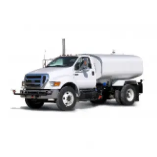 Heavy-duty truck carrying large equipment on construction site