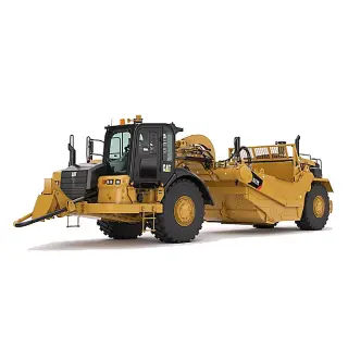 Scraper machine leveling earth for site development